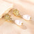 SearchFindOrder Gold Pearl and Flower Earrings